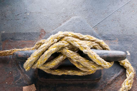 Some rope knotted to a ship
