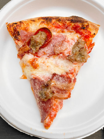 Delicious pizza close up on wooden board and concepts. Italian national food.の写真素材