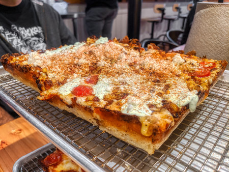 Delicious pizza close up on wooden board and concepts. Italian national food.の写真素材