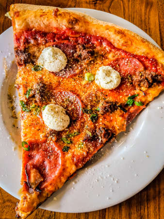 Delicious pizza close up on wooden board and concepts. Italian national food.