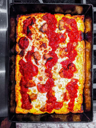 Delicious pizza close up on wooden board and concepts. Italian national food.の写真素材