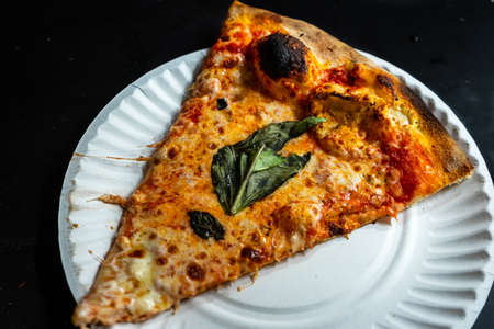 Delicious pizza close up on wooden board and concepts. Italian national food.の写真素材