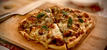 Delicious pizza close up on wooden board and concepts. Italian national food.