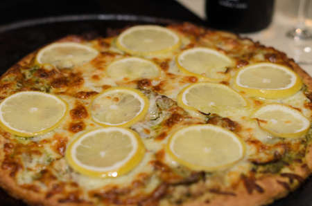 Delicious pizza close up on wooden board and concepts. Italian national food.の写真素材