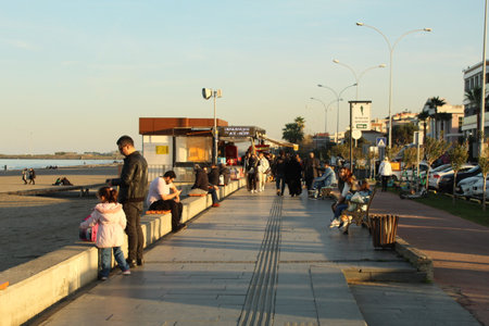 Samsun,Turkey - November 27, 2022 Happy people spending time at the beach side under the sun. high quality photoのeditorial素材