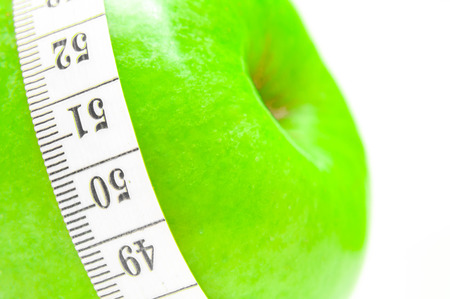 Diet concept . Healthy Living - nutrition and exercising, apple and measurement.の写真素材