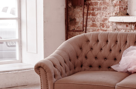 Christmas Tree and Christmas gift boxes in the interior with a fireplace. Christmas living room with fireplace and armchairの写真素材