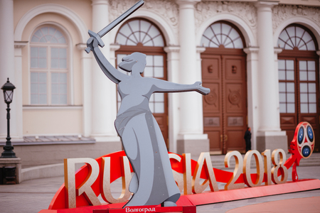 MOSCOW, RUSSIA - MAY 31, 2018: The inscription "Russia 2018" installed before start of FIFA World Cup at Manezh Square. Walking people, Kremlin and Manege Square on the background.のeditorial素材