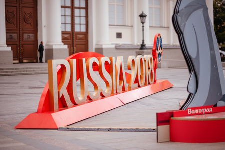 MOSCOW, RUSSIA - MAY 31, 2018: The inscription "Russia 2018" installed before start of FIFA World Cup at Manezh Square. Walking people, Kremlin and Manege Square on the background.のeditorial素材