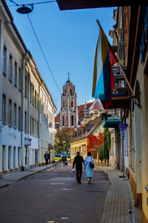 Vilnius, Lithuania - October 9, 2022: Vilnius old town street with the Church of All Saints at the end of it.のeditorial素材