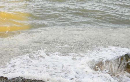 Sunlight falls on the green sea water.の写真素材