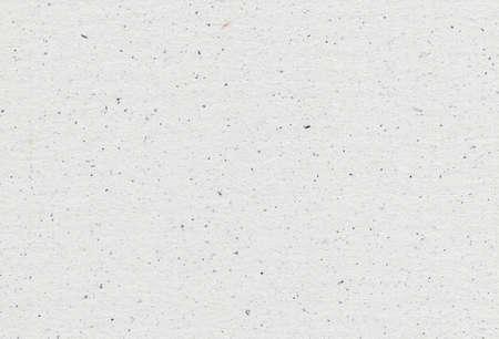 Close up view of grey paper recycled background with inclusions of paper particles. Recycled paper concept.の写真素材