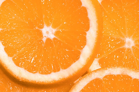 Abstract background with citrus-fruit of orange slices. Close-up