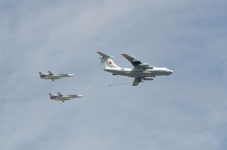 MOSCOW - MAY 9: Aerobatic demonstration team Swifts on Mig-29 and Russian Knights on Su-27 on parade devoted to 70th anniversary of victory in the Great Patriotic war on May 9, 2015 in Moscow.のeditorial素材