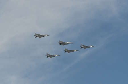 MOSCOW - MAY 9: Aerobatic demonstration team Swifts on Mig-29 and ...