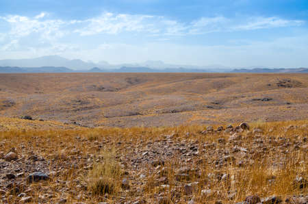 Beautiful landscape of distant mountains in desert of Moroccoの写真素材
