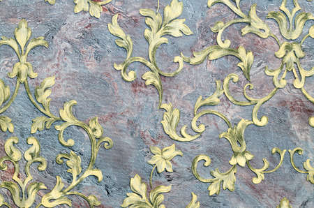 Seamless golden pattern on fabric as background.