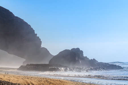 Legzira beach. Red arch on atlantic ocean coast in Morocco. Beautiful oceanic shorelineの写真素材