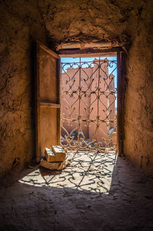Old wooden door in ancient moroccan kasbah in Ait benhaddou clay city in Moroccoの写真素材