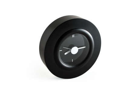 Round black clock with white background