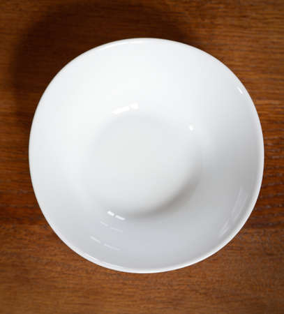 empty plate on a wooden tableの写真素材