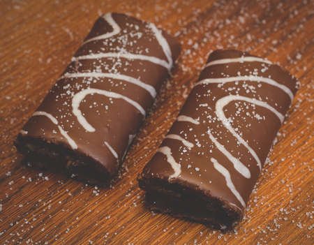 Chocolate Roll Biscuits on a wooden tableの写真素材