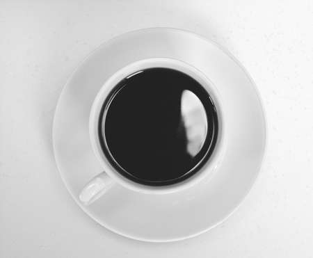 Coffee cup and saucer on a white background.の写真素材