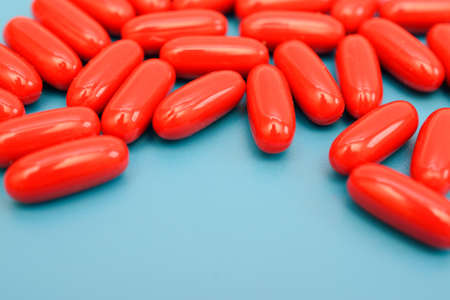 red pills on a blue backgroundの写真素材