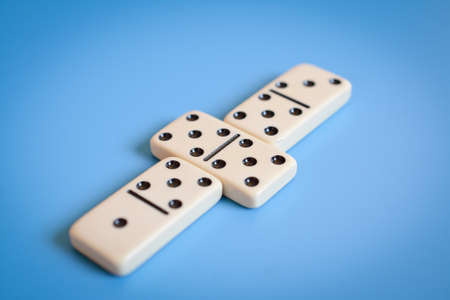Domino parts, only showing number five over blue table. Selective focusの写真素材