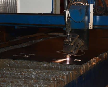 Laser cutting of metal and steel in a factoryの写真素材