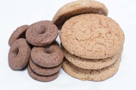 oatmeal and chocol ate chip cookies isolated on a white background close upの写真素材