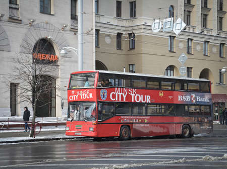 MINSK, BELARUS - January 11, 2017. Minsk city tour bus get tourists for panoramic city tour. The...