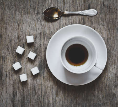 closeup view of a emty cup of coffee with sugar cubes. top viewの写真素材