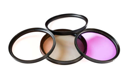 Filter for lenses and camera over white backgroundの写真素材