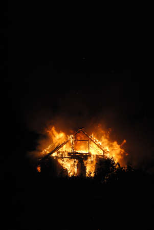 A Wooden house in flames