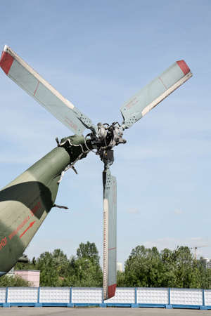 Service and lubrication of a three-bladed helicopter screw on a sunny day.の写真素材