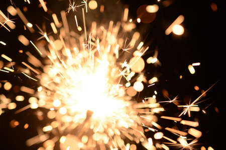 Burning Sparklers in blurred motion. Christmas New Year and Independence Day celebration lights.の写真素材
