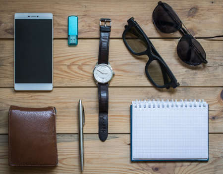 mans set background: wallet, smartphone, pen, watch, notepad and Sunglassesの写真素材