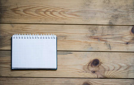 notepad on the wooden table