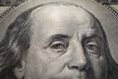 Dollars closeup. Benjamin Franklins portrait on one hundred dollar bill.