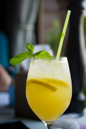 Yellow Bird Cocktail with lemon close up