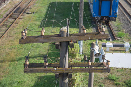 old telephone pole with wiresの写真素材