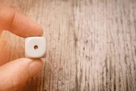game dice number one abstract with copyspace and man hand