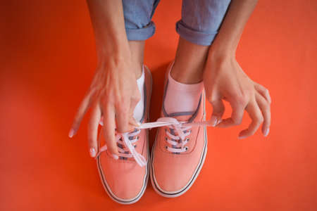 Young Fashion Woman legs over red background