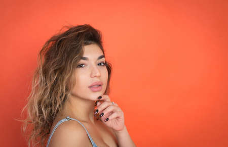 portrait of a beautiful girl on a red background