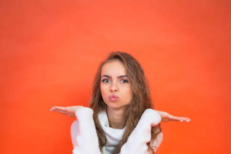Photo of happy delighted woman on red background