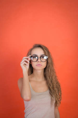 Attractive woman on red color backgroundの写真素材