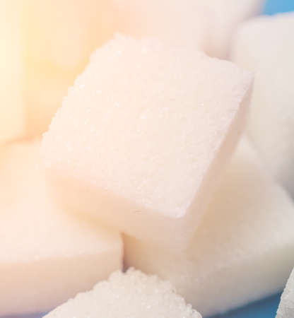 white sugar cubes close up background studio shot