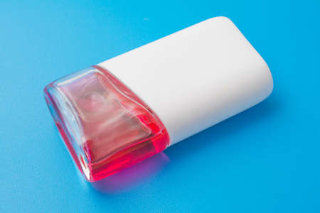 red throat treatment liquid on blue background