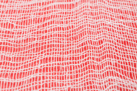 medical bandage texture abstract on red backgroundの写真素材